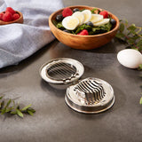 Egg slicer with cut eggs and salad