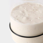 Close up of Breadtopia Sourdough Starter jar with dough