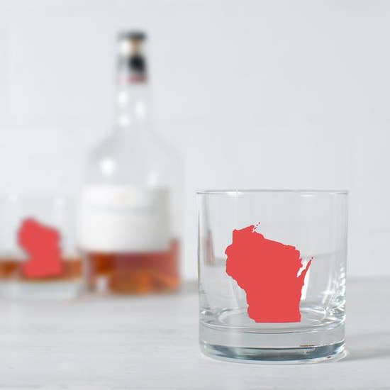 Vital Industries glass with state of Wisconsin in red printed on it.