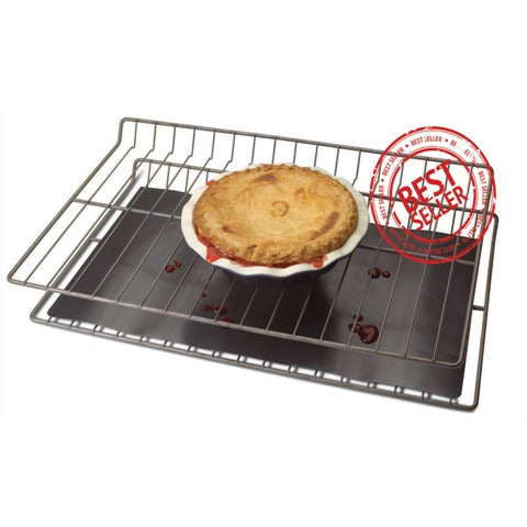 Chefs Planet Commercial Oven Liner protecting the bottom of the oven from cooking pie that has spilled over