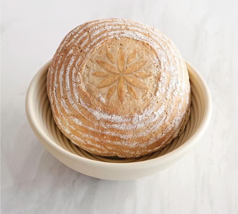 Loaf of bread in proofing basket and embossed with Talisman embosser