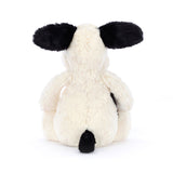 Black and Cream Puppy Stuffed Animal on a white background backside