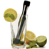 Stainless Steel Muddler crushing lemon and lime in a glass